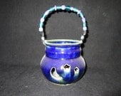 tea light with moon and star design in navy blue