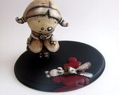 edith and bun-bun, a girl and her dead bunny sculpture