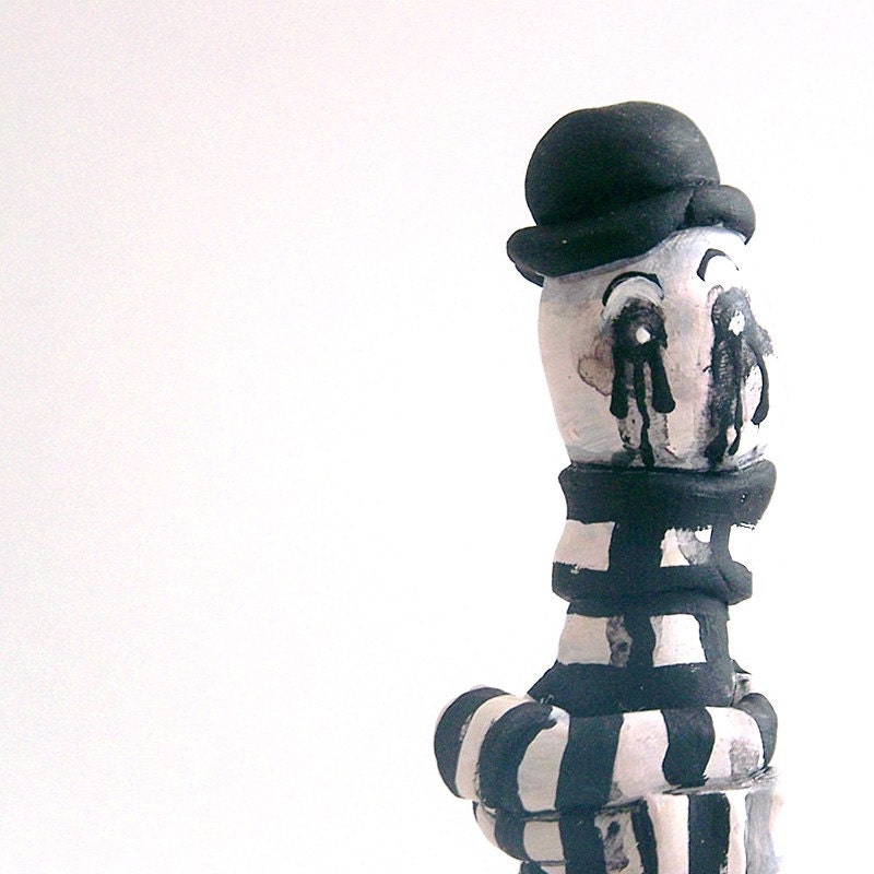mime needs a tissue. weird creepy mime figurine.