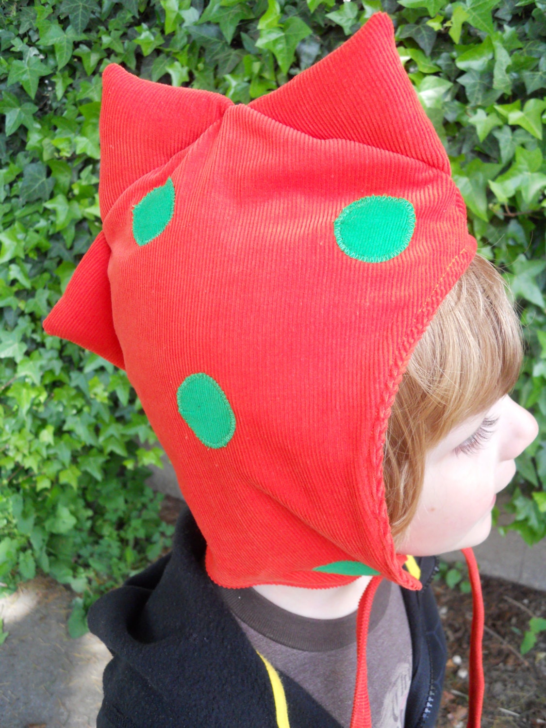Orange and green polka dot dinosaur/dragon hood