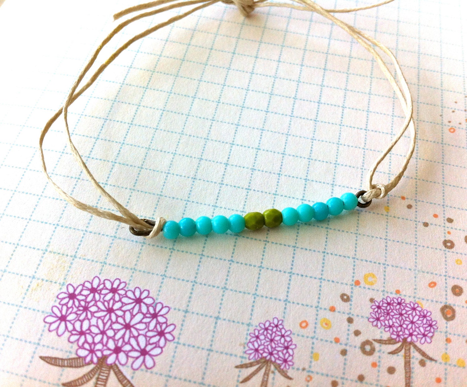 Hannah.blue and green beaded string ,friendship bracelet. Tiedupmemories