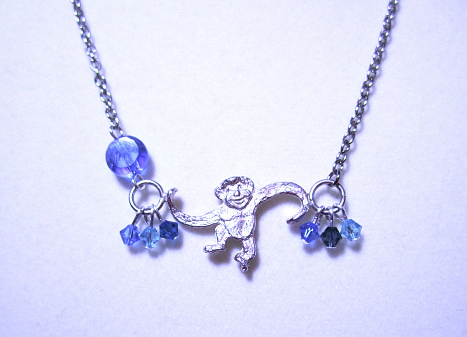 Barrel of Monkeys Necklace Blue Crystal Coin