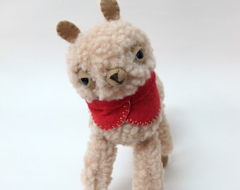 Small Wooly Alpaca in a Fuschia Embroidered Cape