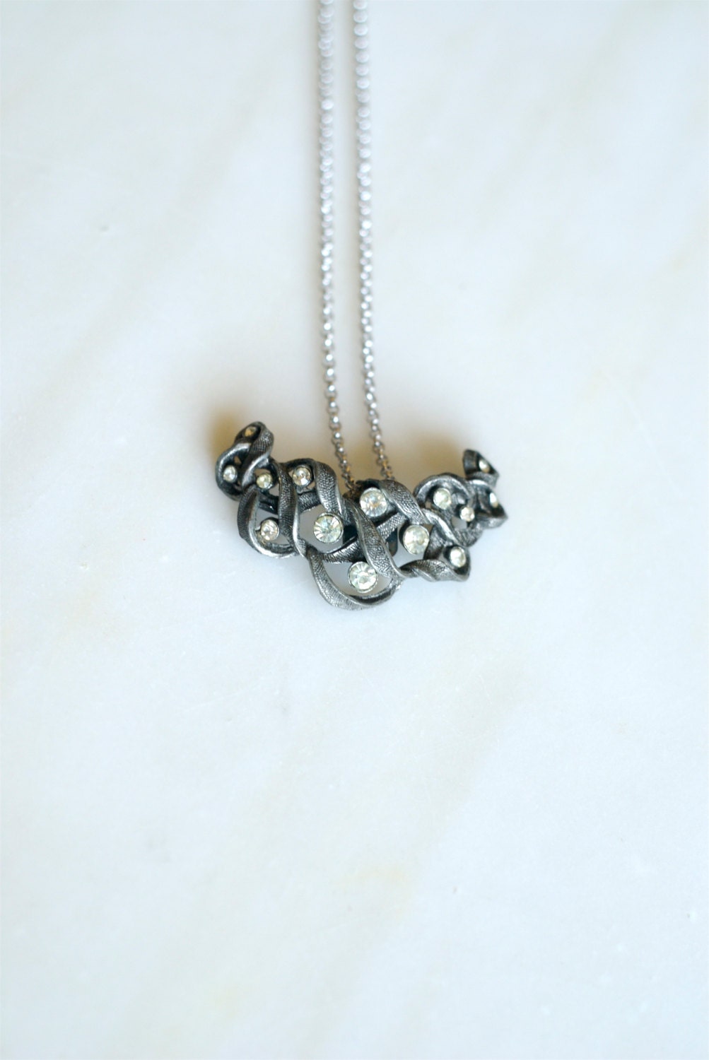 vintage braided diamond crescent shoe clip - turned necklace on a 10 inch chain