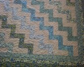 King size quilt in muted greens and turquoise