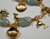 Blue Quartz charm bracelet perfect for summer with sun, shell and dolphin charms