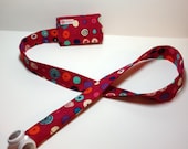 TuneTube.  Earbud cord organizer for iPhone or iPod.  Cord keeper.  Earbud holder.  Earbud case.