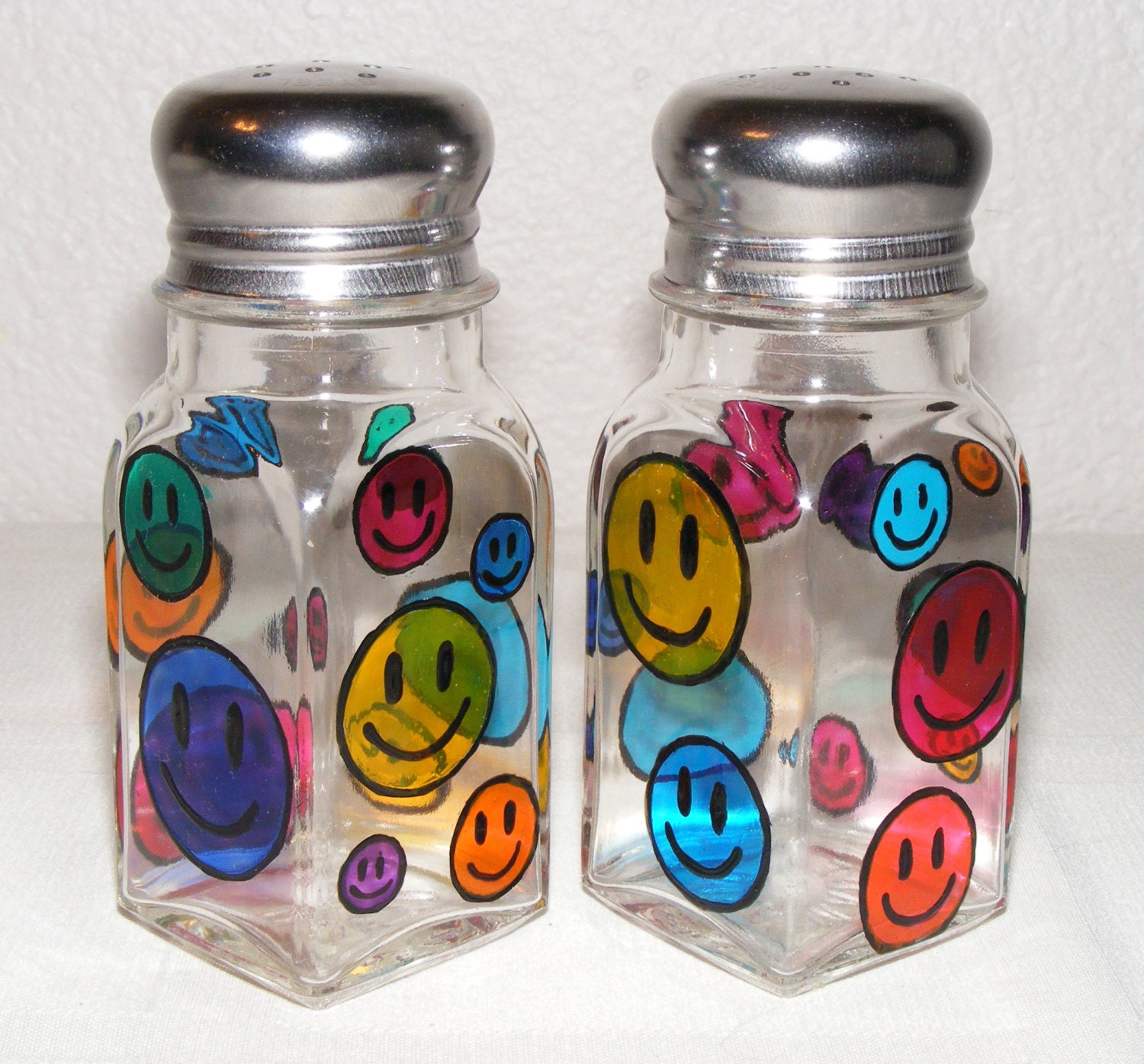 Hand painted glass salt and pepper shakers, happy faces, one pair