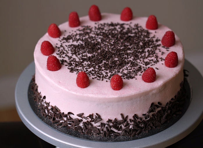 Cookie N Cream cake layered w/ Raspberry cheesecake N Yu Yu's frosting