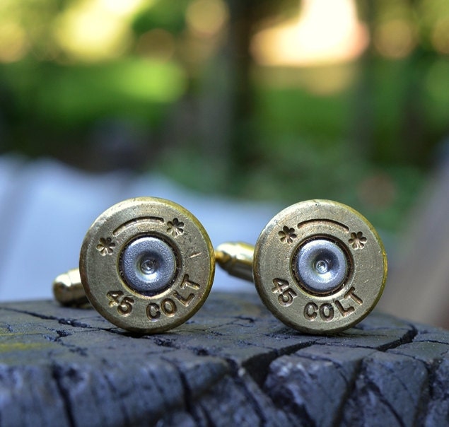 Bullet cufflinks fashioned from repurposed gold/brass Starline .45 Long Colt shell casings
