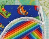 Baby Burp Cloth in a Bright Dinosaru print is cuddley soft for your precious little one to lay thier head.