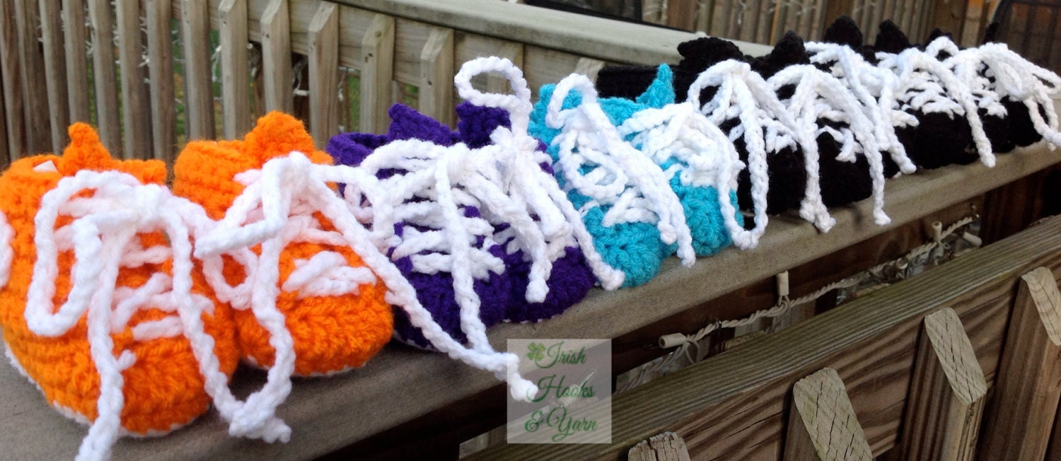 Crocheted soccer cleats for babies in four sizes