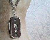NECKLACE sterling silver with rusted keyhole, 18k gold rivets, and cognac diamond