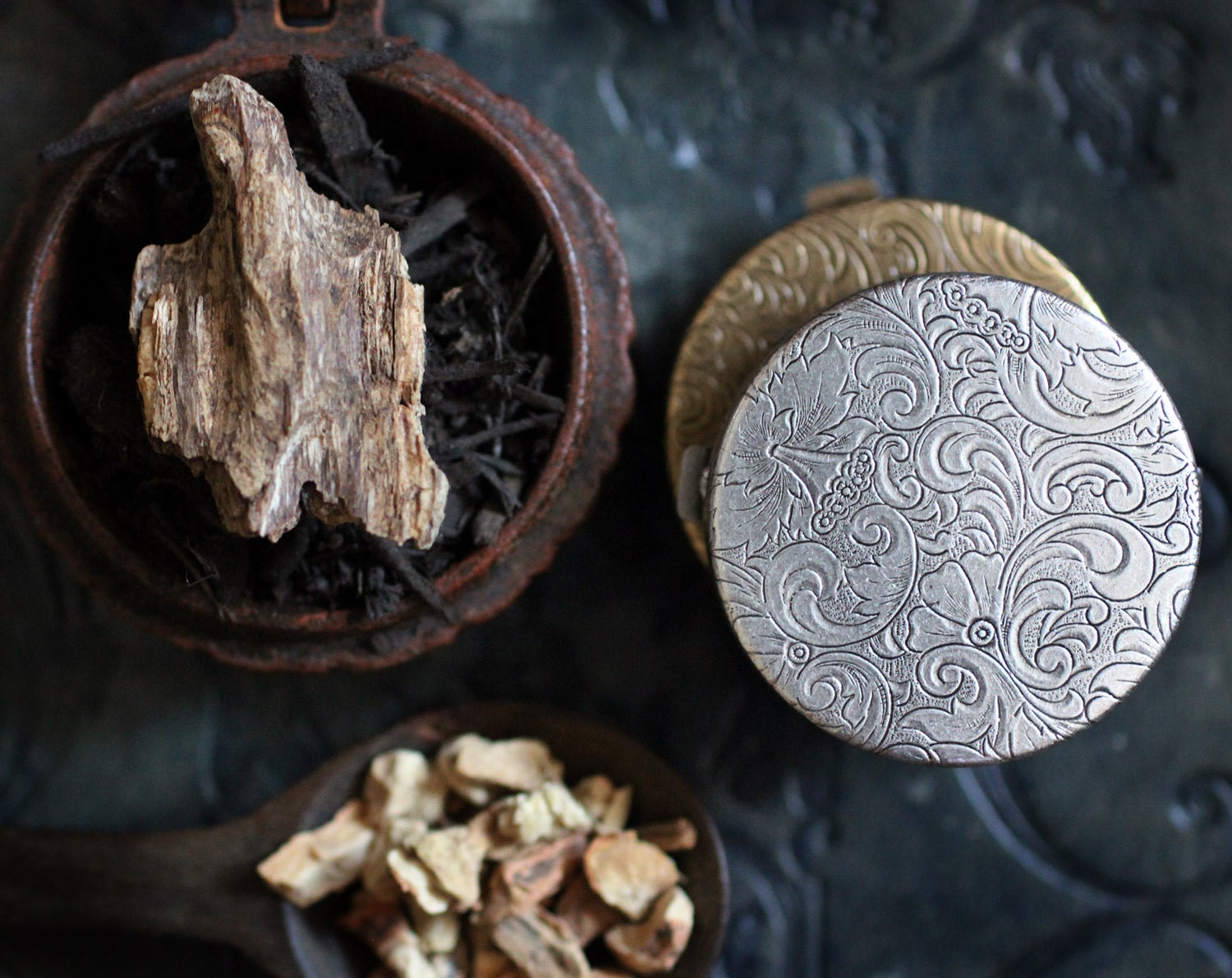 Figure 1: Noir Natural Solid Perfume in a Victorian Compact - Rich and loamy, like vital earth. Black as Night.