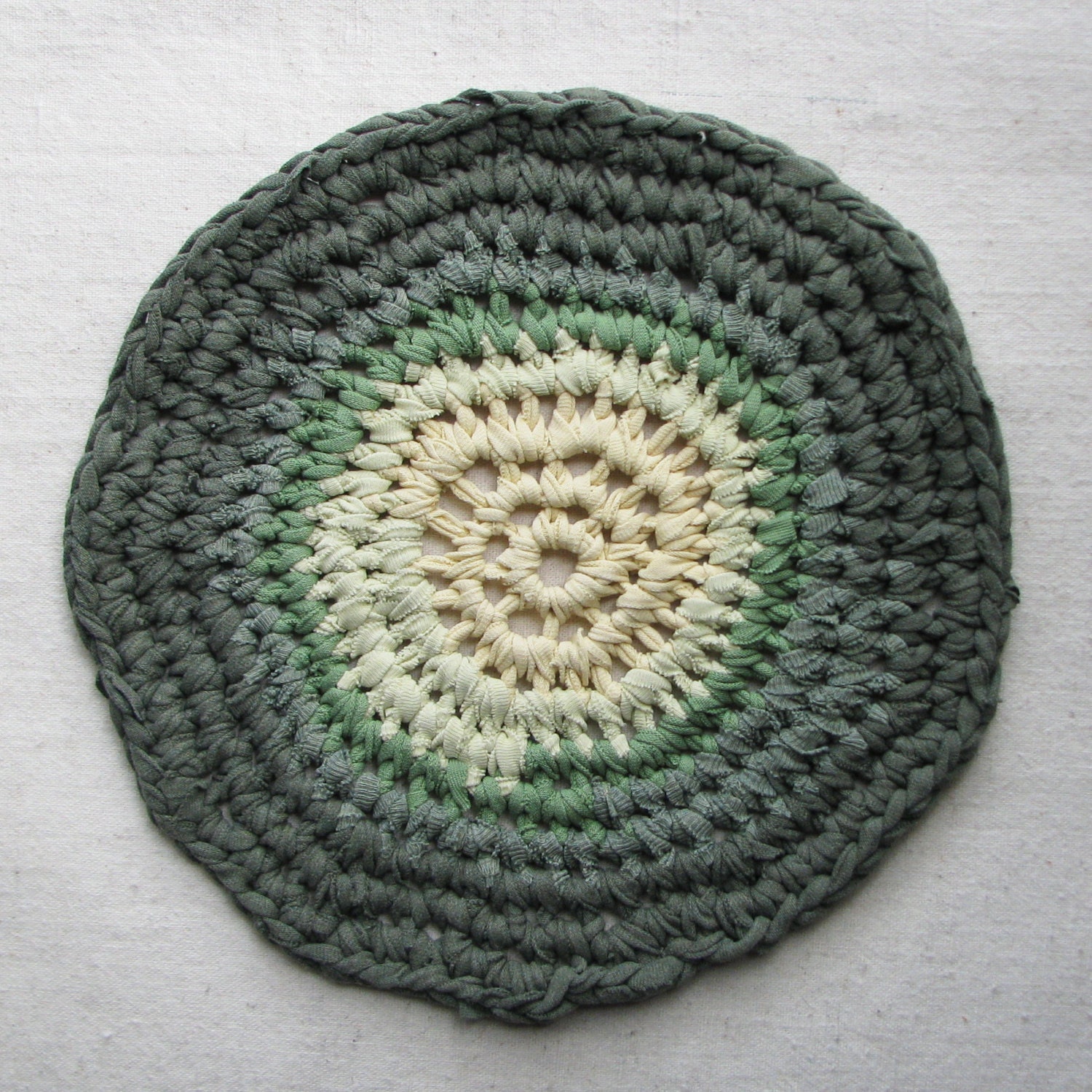 Round trivet, crocheted from eco-friendly cotton t-shirt yarn, large 10" diameter, mossy green and yellow