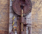 Assemblage art with Vintage found objects on antique reclaimed wood