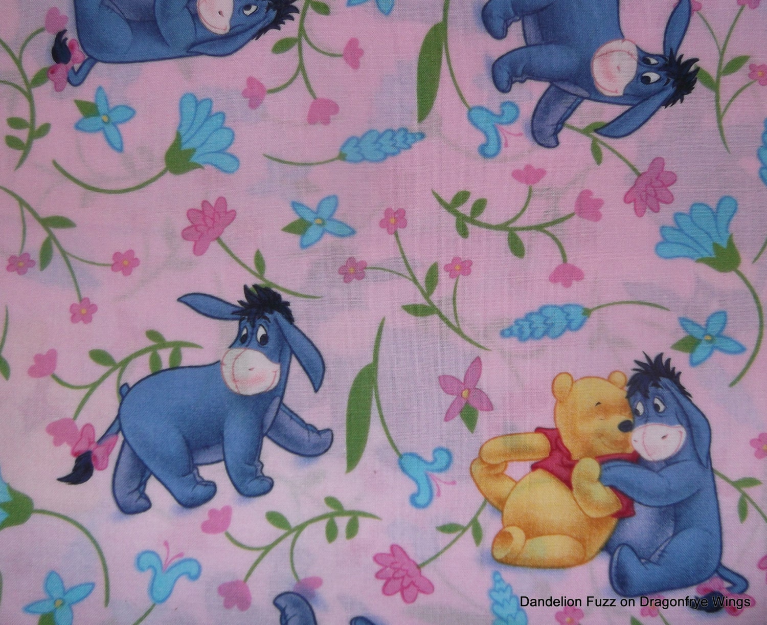 One Yard of Eeyore and Flowers Fabric on a Pink Background