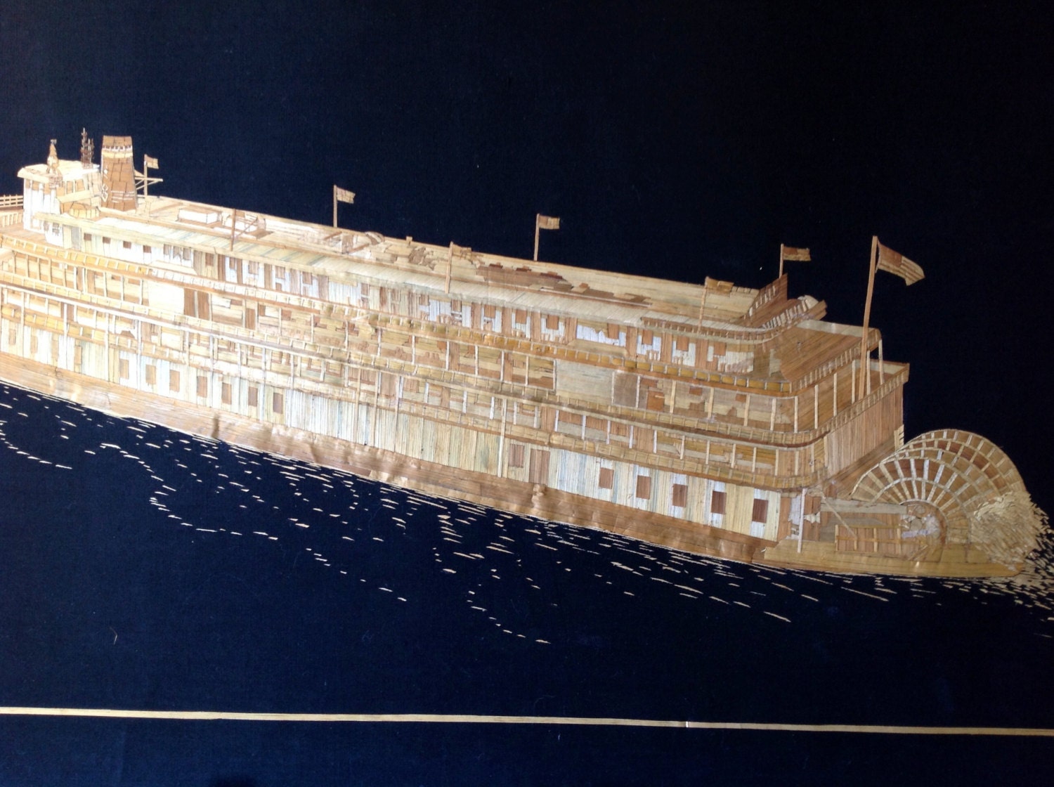 Paddle wheel boat handmade with dried leaves of rice plant. Start your collection of rice straw art