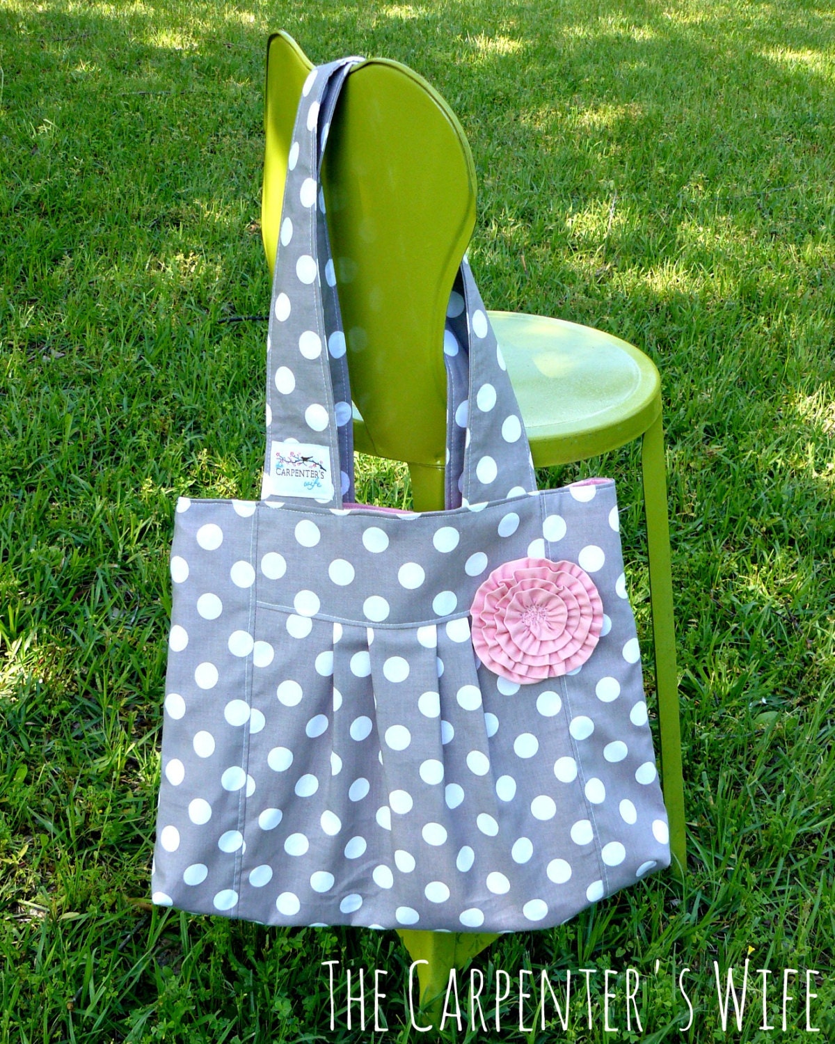 The Leona.... gray polka dot On The Go Diaper Bag, with pink lining and fluffy pink rosette