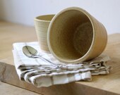 Two stoneware pottery beaker cups - glazed in natural brown