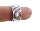 seven skinny sterling silver stacking rings
