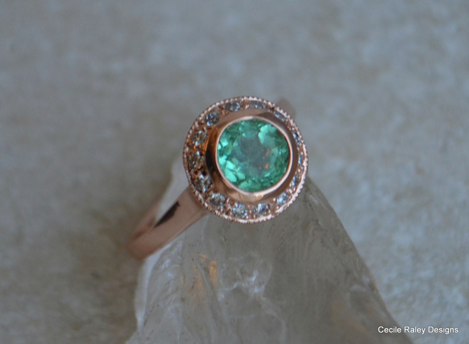 Rose Gold and Colombian Emerald Halo Ring with Diamonds