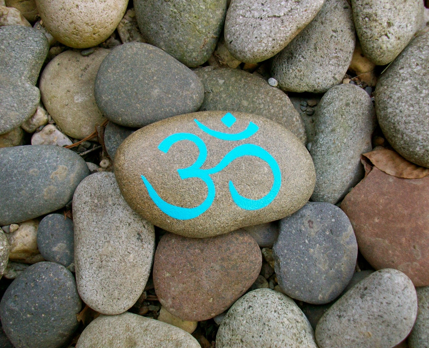 Om Beach Rock Paperweight