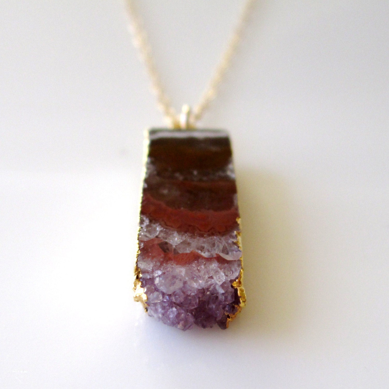 Hera  ...small 24K gold rimmed amethyst geode slice necklace.