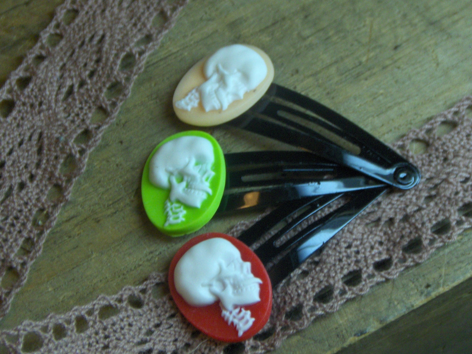 SKULLS. Red, Lime and Butter Yellow skull cameos on black hair barrette clips. Set of 3