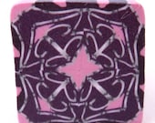 Unbaked pink purple and silver polymer clay cane