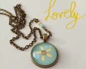 Blue and Yellow Lazy Daisy Glass Cabochon and Paper Pendant Necklace