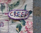 Beaded Creep Badge