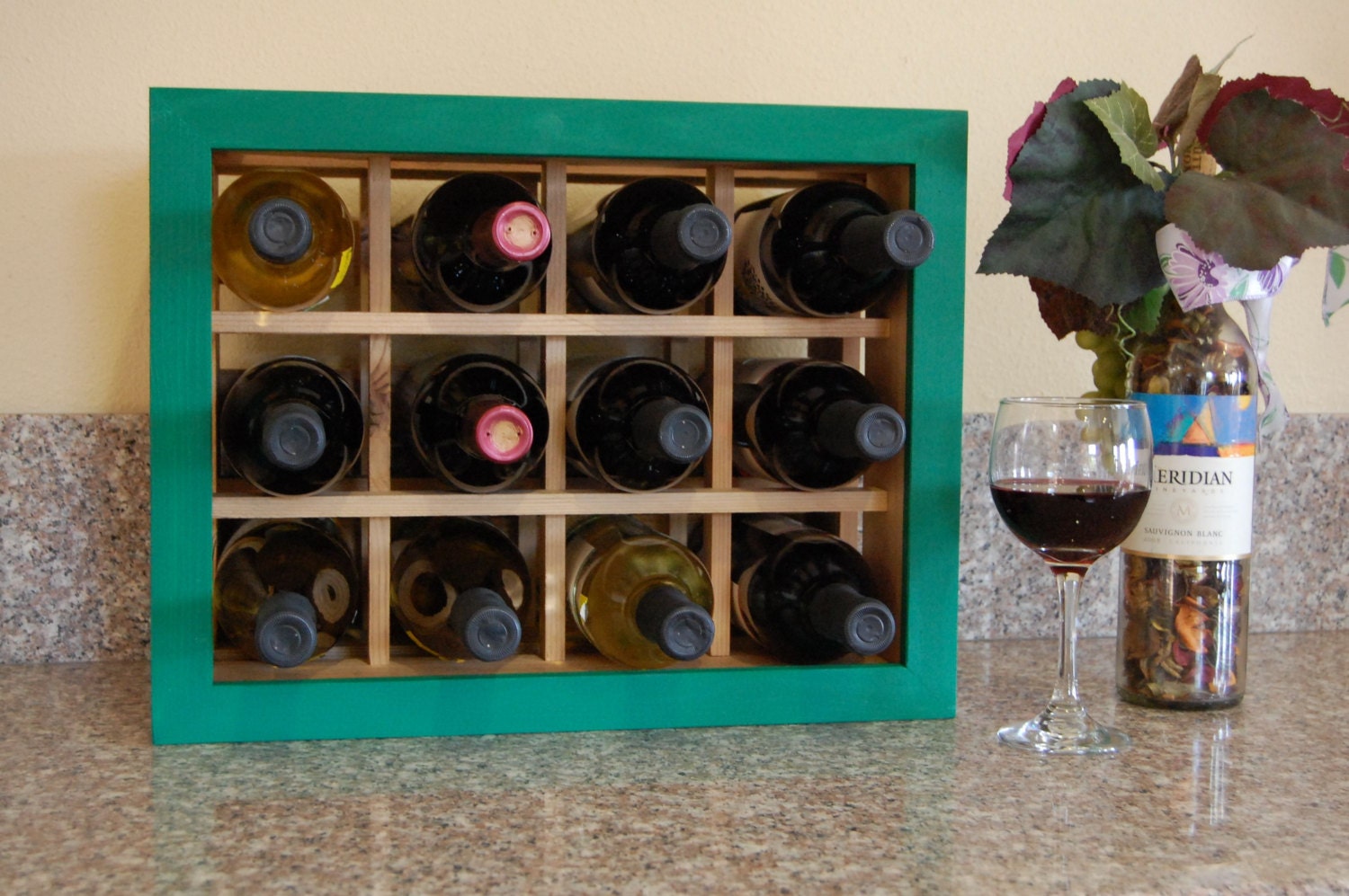 Small space handmade wine rack with green painted frame