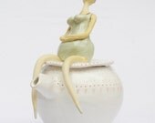 Beautiful old swimmer on teapot with polka dot and hearts