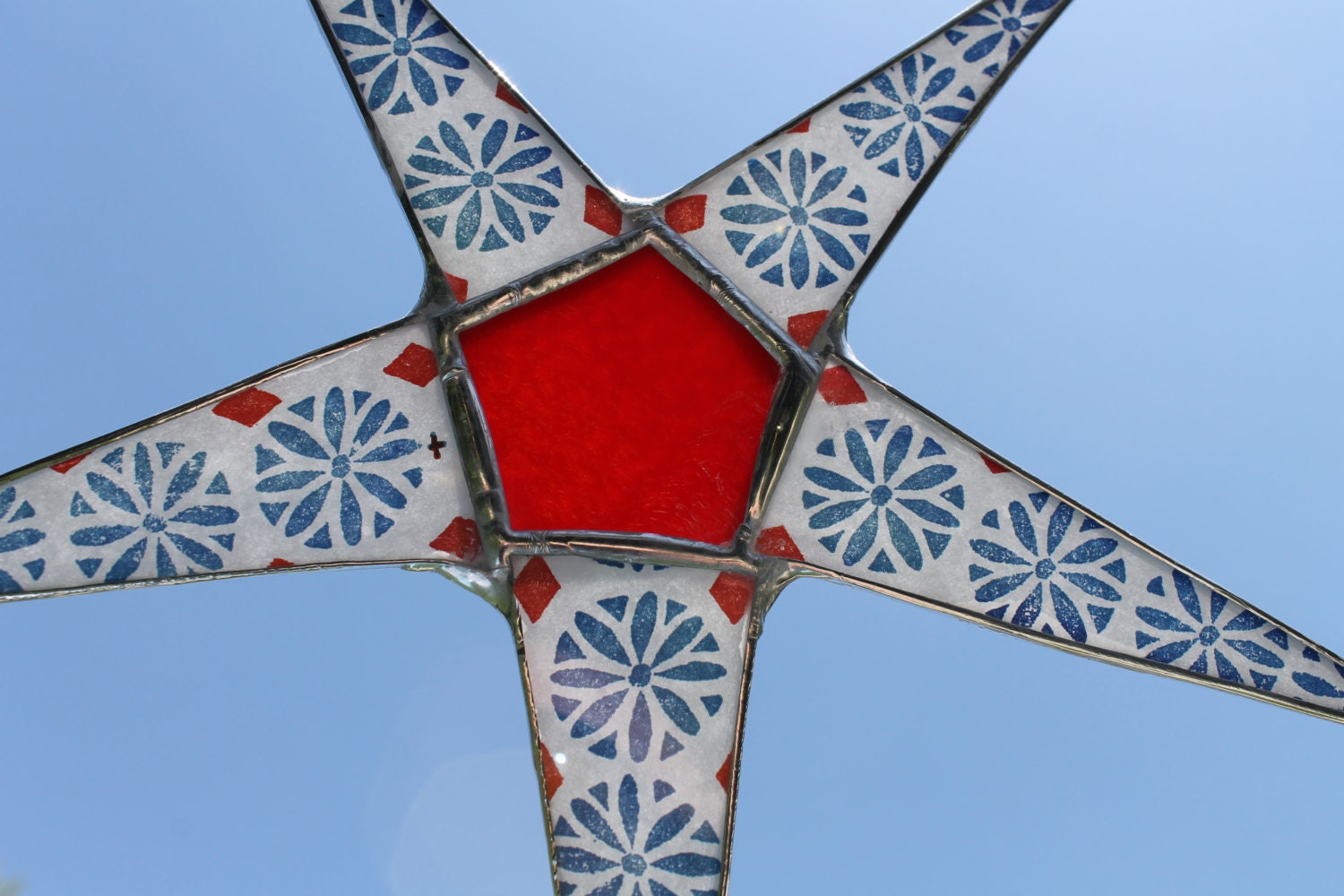 Stencil Star- 8 inch lacquered glass star, red stained glass with paper backed points