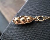 Three Peas in a pod necklace, tiny gold pea necklace, tiny charm jewelry, golden antique bronze