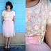 1950s-1960s. pink lace and accordion pleat chiffon party dress with bow by Miss Elliette. s-m