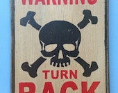 Warning turn back sign made from reclaimed plywood