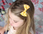 yellow polkadot bow