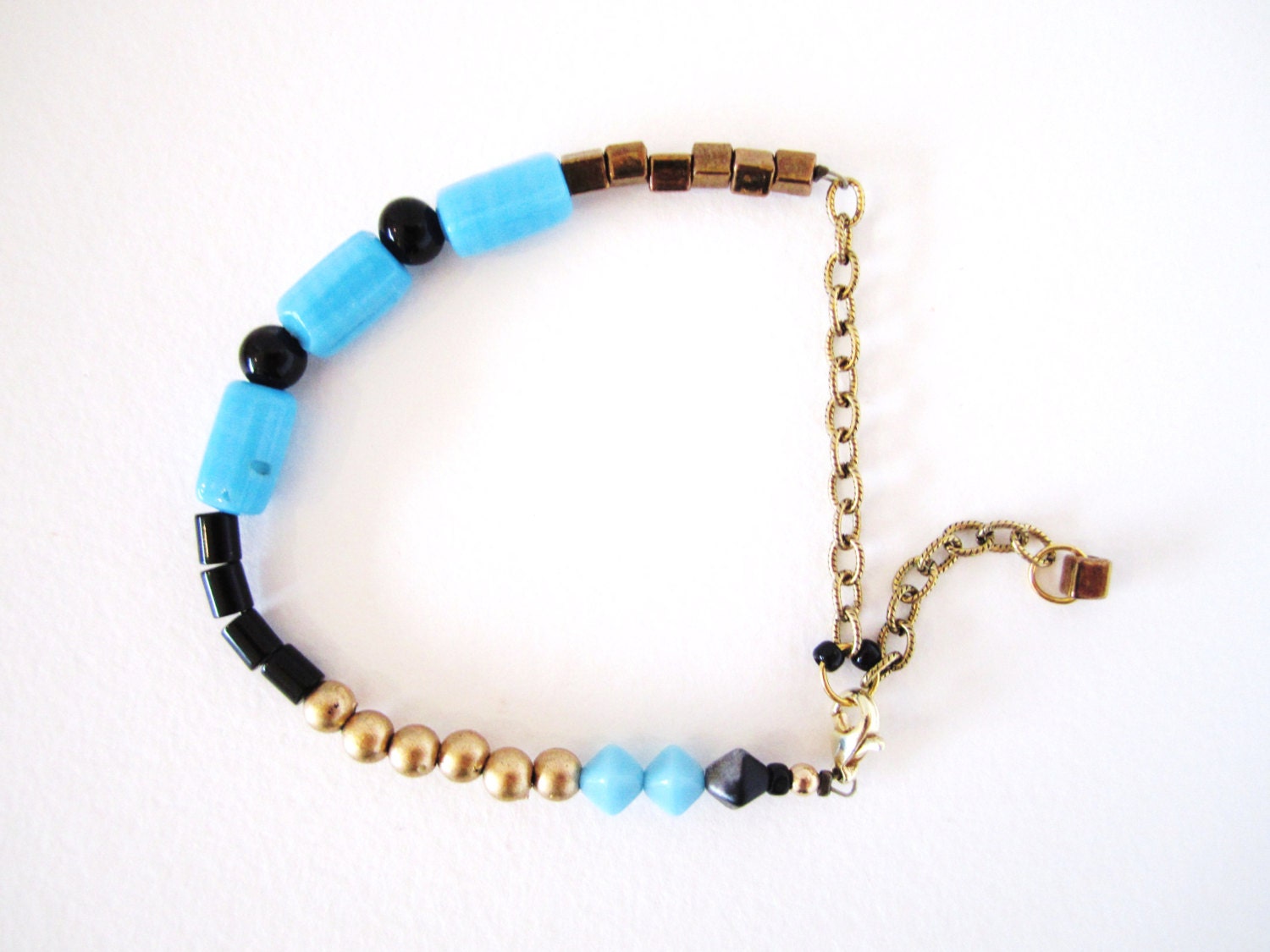 Mixed media bracelet, stacking bracelet, vintage bead bracelet, handmade bracelet, blue, black, gold, onyx by nicobel
