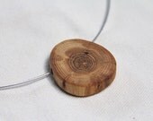 oak wood pendant on a leather cord