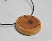 cherry wood pendant on a leather cord