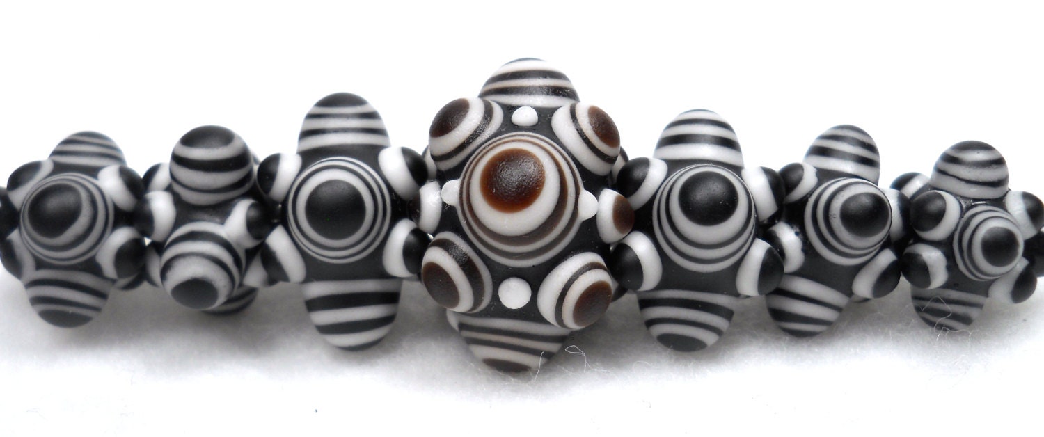 American Trade Bead - Connecticut - Strand of 7 beads. Solid boro glass lampwork.