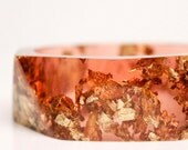 cranberry resin bangle made with eco resin containing gold flakes with large triangle facets