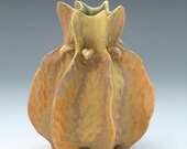 Green, tan, gold carved vase with green interior, porcelain with gold luster detail