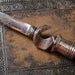 Vintage metal miniature knife, pendant with bottle opener.