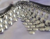 1 metre silver coloured discs metal effect plastic trim. soft grunge cyberpunk