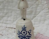 Darling Little Cupie Doll Atop Bell
