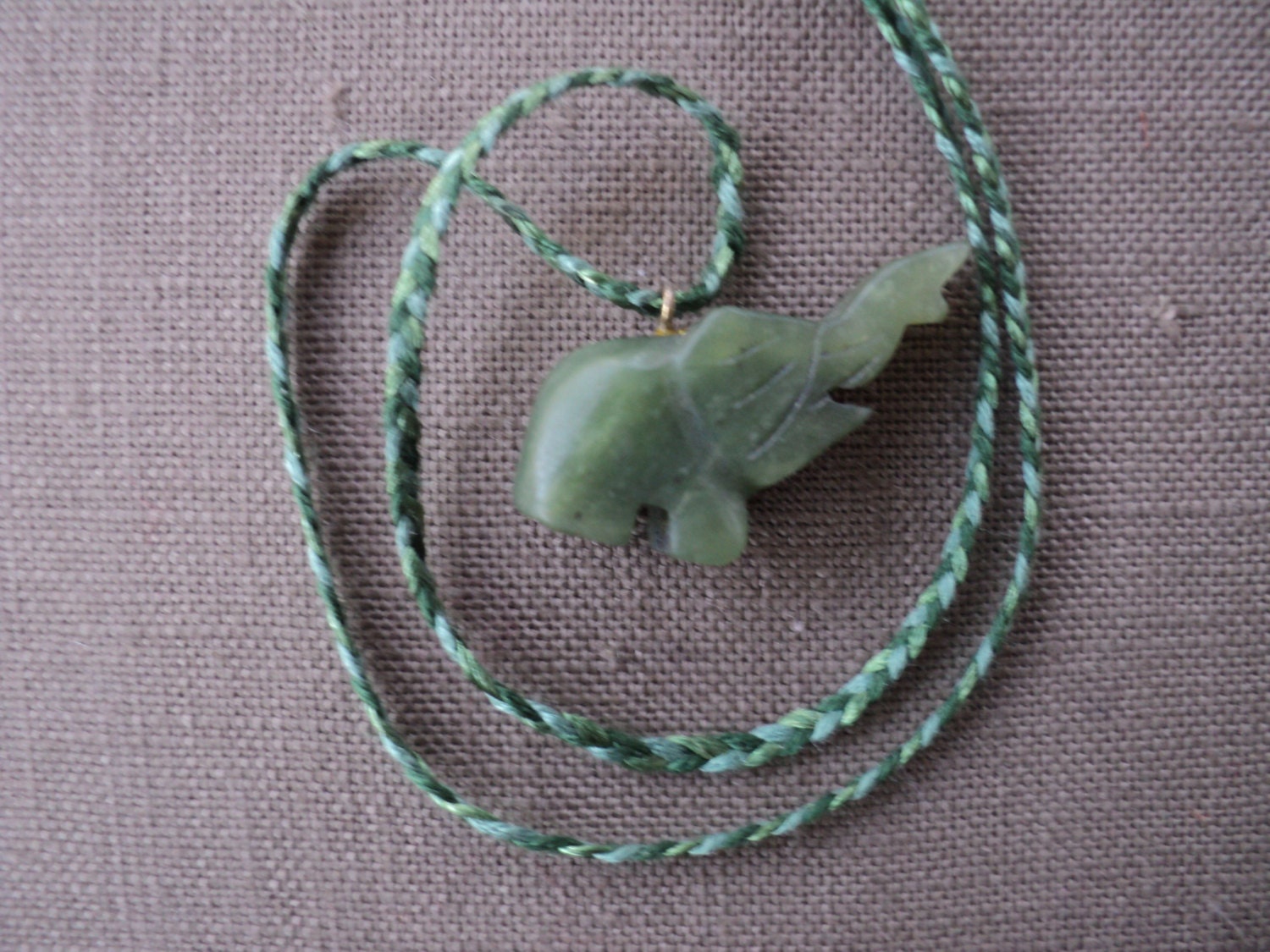 SALE Carved Green stone elephant on hand-braided silk necklace