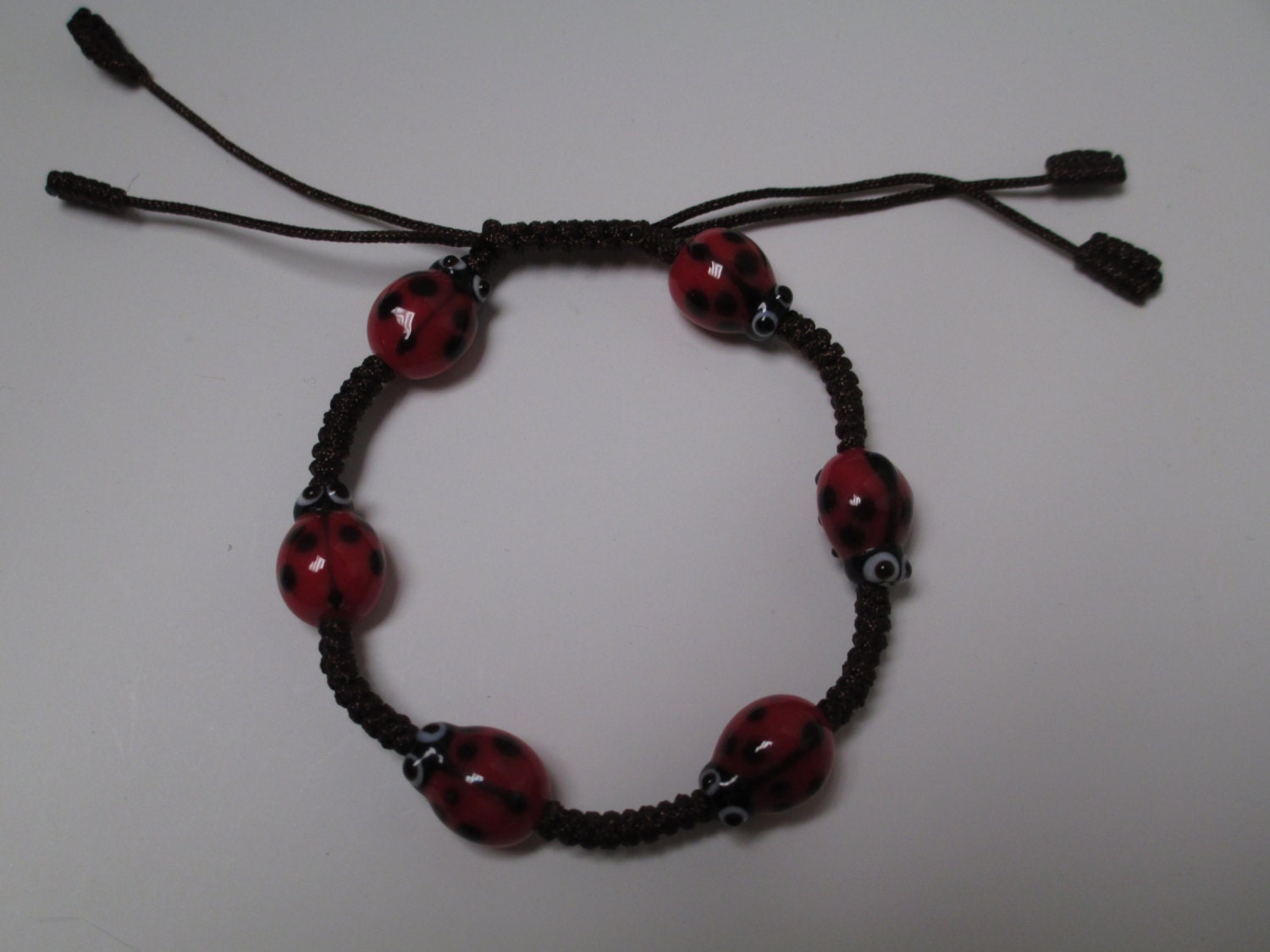 Cotton Cord Bracelet with 6 Glass Ladybug Beads, Hand Knotted Macrame Adjustable Size - Handmade